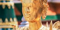 Gold, jeweled statue at the Grand Palace in Bangkok, Thailand