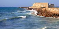 Waves hit a seaside fortres in Heraklion